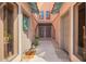 Charming exterior view of entryway featuring a home welcome mat and blue floral wreath at 20660 N 40Th St # 1112, Phoenix, AZ 85050
