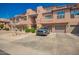 Condominium exterior showcasing well-maintained grounds, garage parking, and attractive architecture at 20660 N 40Th St # 1112, Phoenix, AZ 85050