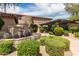 Beautiful landscaped front entrance with a stone water fountain and lush greenery at 20660 N 40Th St # 1112, Phoenix, AZ 85050