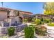 Beautiful landscaped front entrance with a stone water fountain and lush greenery at 20660 N 40Th St # 1112, Phoenix, AZ 85050