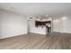 Bright, open floor plan with wood floors connecting to kitchen with stainless steel appliances at 20660 N 40Th St # 1112, Phoenix, AZ 85050