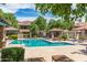 Beautiful community pool with cabanas, lounge chairs, and well-maintained landscaping for a resort-like experience at 20660 N 40Th St # 1112, Phoenix, AZ 85050