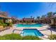 Community pool and spa surrounded by well-manicured landscaping and cabana-style structures at 20660 N 40Th St # 1112, Phoenix, AZ 85050
