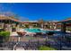Relaxing community pool area with ample seating and shaded lounge spaces at 20660 N 40Th St # 1112, Phoenix, AZ 85050