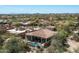 Aerial view showcasing a home with a pristine pool and surrounding desert landscape at 21235 N 80Th Way, Scottsdale, AZ 85255