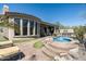 Gorgeous backyard with a pool, spa, and outdoor seating, offering a luxurious retreat at 21235 N 80Th Way, Scottsdale, AZ 85255