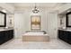 Bathroom with tiled spa tub, dual vanities and ample space at 21235 N 80Th Way, Scottsdale, AZ 85255