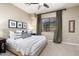 Neutral bedroom features natural light, patterned pillows, and a comfy upholstered bed at 21235 N 80Th Way, Scottsdale, AZ 85255