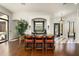 Spacious dining area featuring hardwood floors, custom cabinetry, and comfortable seating at 21235 N 80Th Way, Scottsdale, AZ 85255