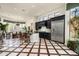 Modern kitchen with black cabinetry, stainless steel appliances, and a large island at 21235 N 80Th Way, Scottsdale, AZ 85255