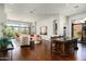 Bright and airy living room featuring hardwood floors, large windows, and open layout at 21235 N 80Th Way, Scottsdale, AZ 85255