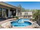 Beautiful backyard oasis with a pool, spa, and elegant seating area, perfect for outdoor relaxation at 21235 N 80Th Way, Scottsdale, AZ 85255