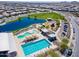 Aerial view of community amenities including pools, a splashpad, playground and a lake at 22656 E Marsh Rd, Queen Creek, AZ 85142