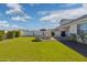 Wide backyard with healthy green grass, patio and outdoor seating area at 22656 E Marsh Rd, Queen Creek, AZ 85142