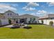 Private backyard with lush green grass, paver patio and comfortable outdoor seating at 22656 E Marsh Rd, Queen Creek, AZ 85142
