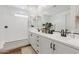 Modern bathroom with dual sinks, white cabinets, and a glass-enclosed shower at 22656 E Marsh Rd, Queen Creek, AZ 85142