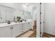 Spacious bathroom with dual vanity, framed mirrors, and modern fixtures at 22656 E Marsh Rd, Queen Creek, AZ 85142