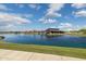 Scenic view of community lake and recreation center at 22656 E Marsh Rd, Queen Creek, AZ 85142