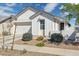 Charming single-story home with white siding, a two-car garage, and desert landscaping for an inviting curb appeal at 22656 E Marsh Rd, Queen Creek, AZ 85142