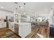 Bright, open-concept kitchen featuring a large island, stainless steel appliances, and seamless flow to the living area at 22656 E Marsh Rd, Queen Creek, AZ 85142