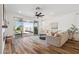 Comfortable living room with sliding glass doors to the backyard, offering plenty of natural light and indoor-outdoor living at 22656 E Marsh Rd, Queen Creek, AZ 85142