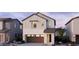 Charming two-story home featuring a neutral color palette, attached garage and an inviting front entrance at 2457 W Rowel Rd, Phoenix, AZ 85085