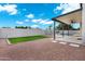 A well-kept backyard features sleek concrete finishes with low maintenance rock and an enclosed pool area at 2522 N Robin Ln, Mesa, AZ 85213