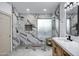 Modern bathroom featuring glass enclosed marble shower, sink, and cabinet at 2522 N Robin Ln, Mesa, AZ 85213
