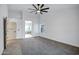 Bright carpeted bedroom offers ceiling fan and access to a private bathroom at 2522 N Robin Ln, Mesa, AZ 85213