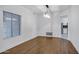 Bright dining room with hardwood floors, chandelier, and view to the kitchen at 2522 N Robin Ln, Mesa, AZ 85213