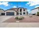 Beautiful two-story home featuring a tiled roof, arched entry, and a low-maintenance desert landscape at 2522 N Robin Ln, Mesa, AZ 85213