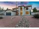 Beautiful two-story home featuring a tiled roof, arched entry, and a low-maintenance desert landscape at 2522 N Robin Ln, Mesa, AZ 85213