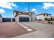 Lovely two-story home with an attached garage, desert landscaping, and white stone driveway at 2522 N Robin Ln, Mesa, AZ 85213