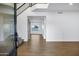 Bright foyer with staircase, sleek railing, and stylish, light hardwood flooring at 2522 N Robin Ln, Mesa, AZ 85213