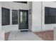 Close-up of the front door showing modern design, hardware, and welcome mat at 2522 N Robin Ln, Mesa, AZ 85213