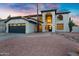 Charming two-story home with unique architectural details and a well-manicured desert landscape at 2522 N Robin Ln, Mesa, AZ 85213