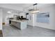 Modern kitchen boasts an island with marble countertop and stylish lighting fixture at 2522 N Robin Ln, Mesa, AZ 85213