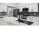 Close-up view of kitchen features stainless steel appliances, granite countertops, and modern fixtures at 2522 N Robin Ln, Mesa, AZ 85213