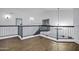 A landing featuring contemporary railings, wood floors, and ample natural light at 2522 N Robin Ln, Mesa, AZ 85213