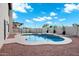 Sparkling pool with elegant tile accents and beautiful rock landscaping creates a resort-style backyard at 2522 N Robin Ln, Mesa, AZ 85213