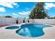 Sparkling pool with elegant tile accents and beautiful rock landscaping creates a resort-style backyard at 2522 N Robin Ln, Mesa, AZ 85213
