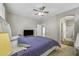 Spacious bedroom featuring a ceiling fan, soft carpet, and a comfortable bed at 2673 E Remington Pl, Chandler, AZ 85286