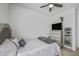 Comfortable bedroom with a stylish bed, sleek dresser with TV, and a full length mirror at 2673 E Remington Pl, Chandler, AZ 85286