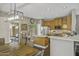 Bright kitchen featuring stainless steel appliances, wooden cabinets, and an adjacent dining area at 2673 E Remington Pl, Chandler, AZ 85286