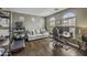 Hardwood floors enhance this versatile space, featuring a home office, seating area, and natural light at 2673 E Remington Pl, Chandler, AZ 85286