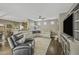 Open living area with a large sectional sofa, flat screen TV, and recessed lighting at 2673 E Remington Pl, Chandler, AZ 85286