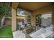 Relaxing covered patio featuring a cozy sofa and armchairs at 2673 E Remington Pl, Chandler, AZ 85286