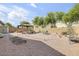 Picturesque backyard with a gazebo, brick patio, and easy-care desert landscaping at 2857 N Mystic Ct, Casa Grande, AZ 85122