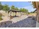 Expansive backyard featuring a gazebo, brick patio, and low-maintenance landscaping at 2857 N Mystic Ct, Casa Grande, AZ 85122