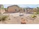 Charming backyard with a gazebo, brick patio, desert landscaping, and space to garden at 2857 N Mystic Ct, Casa Grande, AZ 85122